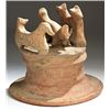 Image 1 : Terracotta. Terracotta group. Hellenistic period?.  D/ Three figures on plinth. 18 cm high.        R
