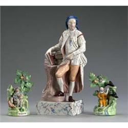 A Pair of Pearlware Figures Depicting 'Elijah' and 'Widow'], on bocage supports, picked out in co...