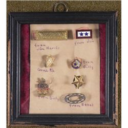 6 WWII INSIGNIAS IN FRAME FROM EACH FAMILY MEMBER