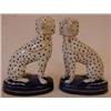 A Pair of Dalmatian Dogs, seated, with gilt chains, on oval blue bases, 16 cm, (2)  See illustrat...