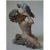 A Royal Copenhagen Group, of a young Bacchus and an exotic bird, 18 cm  See illustration £30-50...