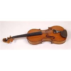 A Violin, with a two piece back, bears a label 'Wolfe Bros, Manufacturers Class 1, No 3007, 1899'...