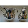 Image 1 : A Silver Cream Jug, initialed and dated, Birmingham 1920, 9 cm, and a silver Guernsey cream jug a...