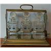 Image 1 : A Walker and Hall Plated Tantalus, with engraved decoration, and three numbered glass decanters a...