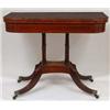 Image 1 : A Regency Mahogany Tea Table, the shaped square top on turned supports, downswept legs, brass cap...