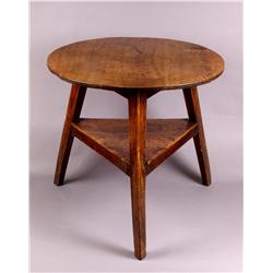 A Late 18th Century Oak Cricket Table], with circular top on chamfered triangular section outspla...