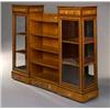 Image 1 : A Late Victorian Satinwood and Flower-painted Bookcase], with a central section of five shelves f...