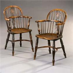 A Pair of 19th Century Yew and Elm Windsor Elbow Chairs, the low bow backs with pierced splats, t...