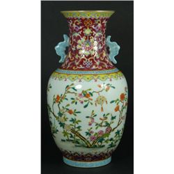 A CHINESE FAMILLE ROSE HANDLED PORCELAIN VASE