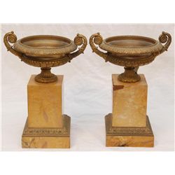 PAIR OF BRONZE URNS MOUNTED ON MARBLE BASES