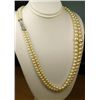 Exquisite estate ladies graduating double  strand of rose pink colors pearls on a 14  karat white go