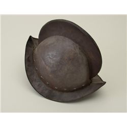 Movie prop metal Spanish-style helmet in  overall good condition showing a dark patina;  some scatte