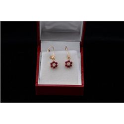 14kt yellow gold earrings set with diamonds  and rubies. Est.$100-$200.