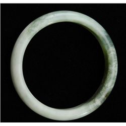 One jade light green jade bangle bracelet.  Est.: $150-$300