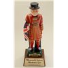 Beefeater Gin display advertiser featuring  famous “Guard” holding Union Jack; porcelain  on wood ba