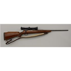 Browning bolt action rifle. 243 cal, Leopold  scope on Redfield mounts. QD sling swivels  with leath