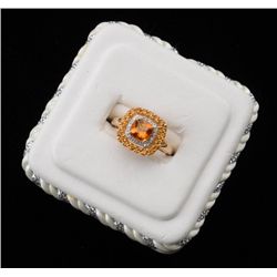 One ladies ring in 14k yellow gold set with a  cushion cut citrine, a row of round citrine  and a ro