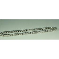 Sleek ladies sterling silver tennis style  bracelet set with over 50 round diamonds  weighing approx