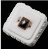 One antique black onyx ring in 10k rose gold  set with a diamond in a white gold bezel.  Est.$500-60