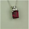 Image 1 : Gorgeous 14 karat white gold ladies pendant  set with an emerald cut created Ruby weighing  approx. 