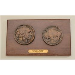 Two large cast bronze medallions featuring  buffalo nickel by Fraizer on display plaque,  approx. 10