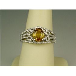 Intricate 14 karat white gold ladies custom  made ring by ‘VJ’ set with an intense yellow  Sapphire 