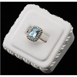 One ladies ring made in 14k white gold set  with an emerald cut aquamarine weighing  approx. 5ct and