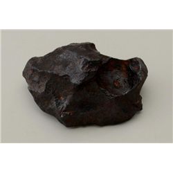 Large meterorite approx. 6” in length and  approx. 2-1/2” in height, very heavy and  dense; from an 