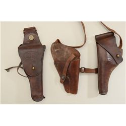 Lot of three U.S. military leather holsters  including a flap holster with swivel for a  1911 pistol