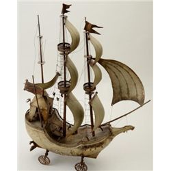 Antique brass and silver plated ship, 32” in  height, 21” long, good metal work, on wheels,  needs T