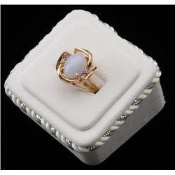 One ladies ring in 14 k yellow gold set with  a lavender jade and amethyst. Est.$500-$750.