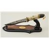 Image 1 : Modern display knife with stand in good  condition; knife is approx. 13-1/2” overall  showing orname