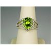 Image 1 : Dazzling 14 karat white gold ladies designer  ring set with a fine Peridot weighing approx.  6.00 ca