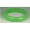 Image 1 : Nice green Jade bangle. Estimate $200-$400