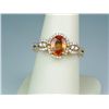 Image 1 : Gorgeous 14 karat yellow gold ladies designer  ring set with an intense orange sapphire  weighing ap