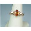 Image 1 : Gorgeous 14 karat yellow gold ladies designer  ring set with an intense orange sapphire  weighing ap