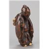 Image 1 : ,A wood netsuke of a Chinese scholar.