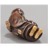 Image 5 : ,A wood netsuke of a Chinese scholar.