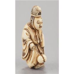 An ivory netsuke of a court noble.