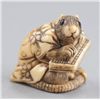 Image 1 : An ivory netsuke of a rat in gown.