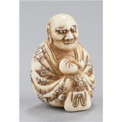 An ivory netsuke of Daruma.