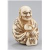 Image 1 : An ivory netsuke of Daruma.