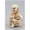 Image 2 : An ivory netsuke of Daruma.
