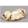 Image 3 : An ivory netsuke of a recumbent ox.