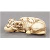 Image 4 : An ivory netsuke of a recumbent ox.