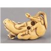 Image 5 : An ivory netsuke of a recumbent ox.
