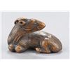Image 1 : A wood netsuke of a recumbent goat.