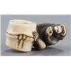 Image 6 : An ivory netsuke of a monkey.