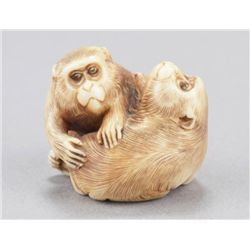 An ivory netsuke of two monkeys.