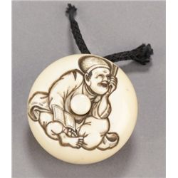 An ivory manju of a Noh play prompter.